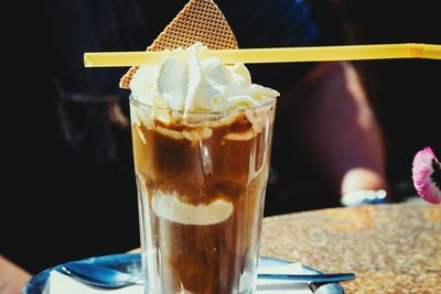 Close-up of fresh dessert served on table at sidewalk cafe