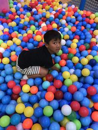 High angle view of boy playing with ball