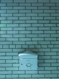 Close-up of mailbox on wall