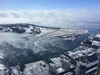 Aerial view of billy bishop toronto city airport against sky