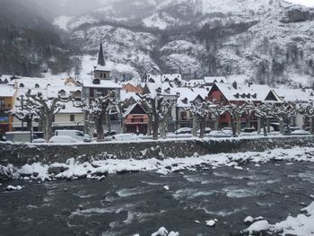 Houses on snow covered landscape