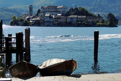 Wooden posts on building by sea