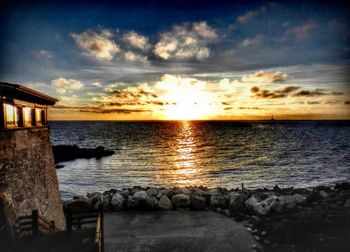 Scenic view of sea at sunset