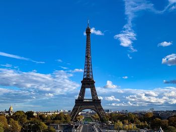 Tower against cloudy sky