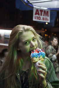 Portrait of woman holding ice cream