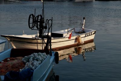 Fishing boats moored in lake