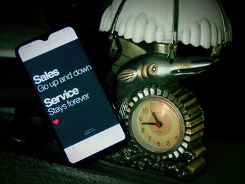 High angle view of clock on table