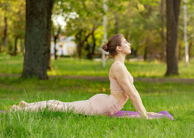 Woman stretching in park