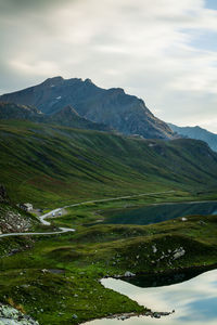 Scenic view of mountains against cloudy sky at gran paradiso national park