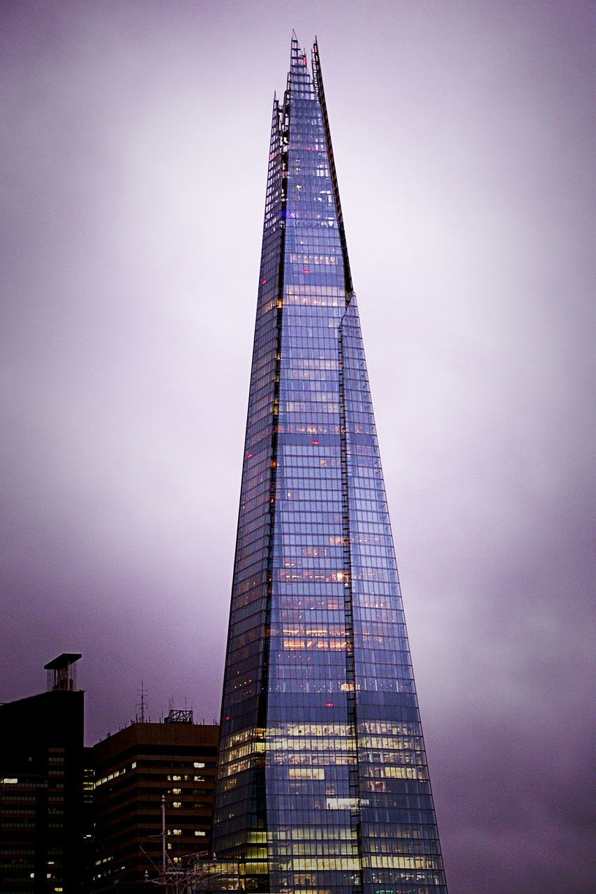 LOW ANGLE VIEW OF ILLUMINATED BUILDINGS AGAINST SKY