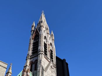 Low angle view of building against blue sky