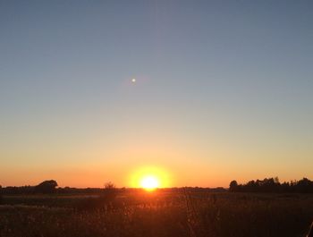 Scenic view of landscape at sunset