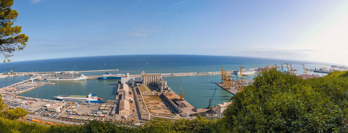 High angle view of buildings and sea against sky