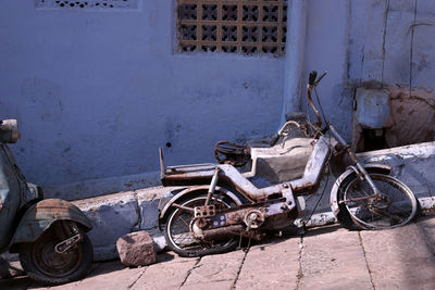 Bicycles on street by old building