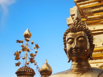 Low angle view of statue against sky
