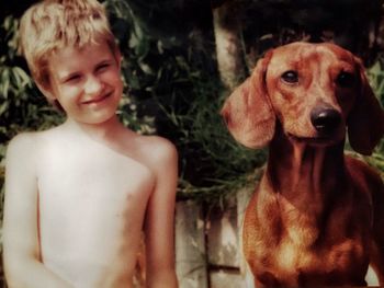 Portrait of cute boy with dog
