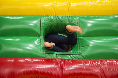 Low section of child in bouncy castle