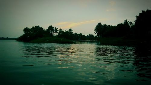 Scenic view of lake at sunset