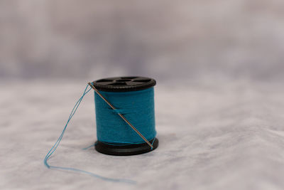 Close up of thread with needle