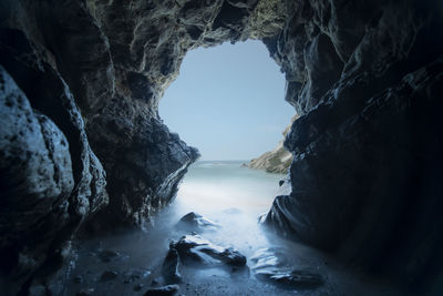 Pacific waves crash through a sea cave at leo carillo state park