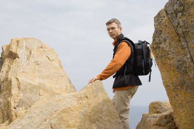 Low angle view of man hiking