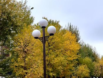 Low angle view of street light against sky