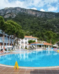 View of swimming pool against mountain