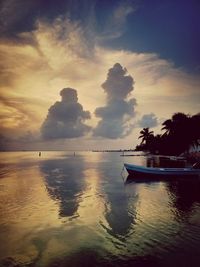 Scenic view of sea against cloudy sky