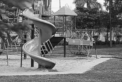 Side view of empty swing in park