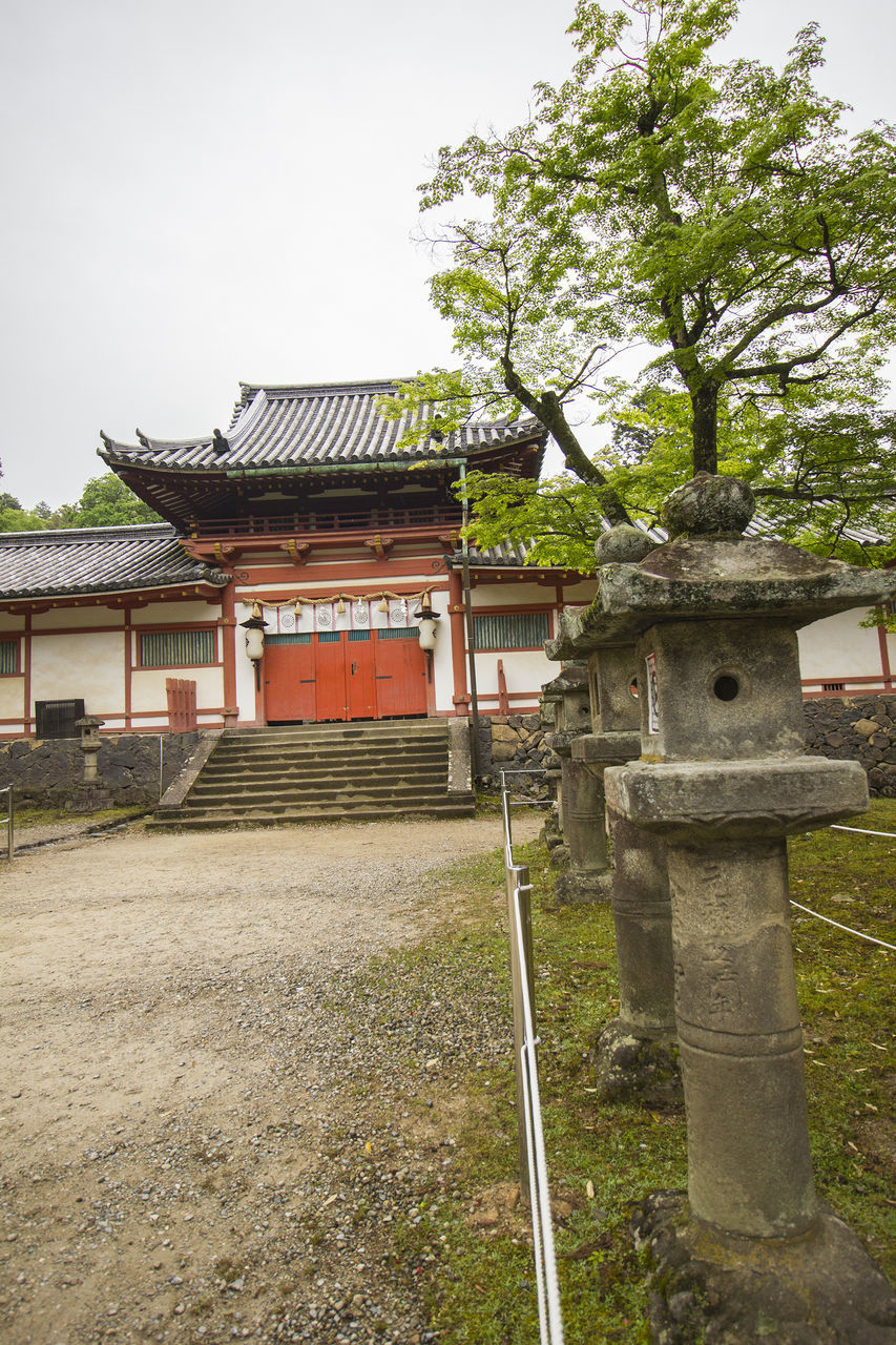 ENTRANCE OF TEMPLE AGAINST BUILDING