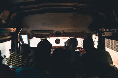 Rear view of people sitting in bus