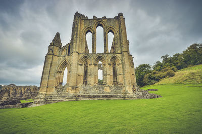 View of old ruin building against cloudy sky