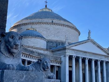 Low angle view of statue of historical building against sky