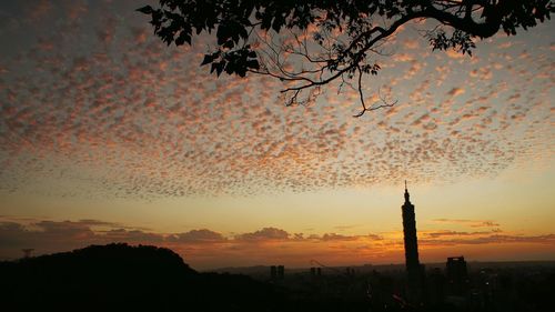 Silhouette of building at sunset