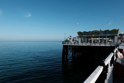 Pier over sea against sky