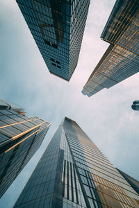 Low angle view of modern buildings against sky