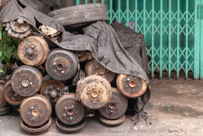 Close-up of abandoned vehicle parts on street