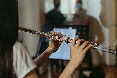 Close-up of woman playing guitar