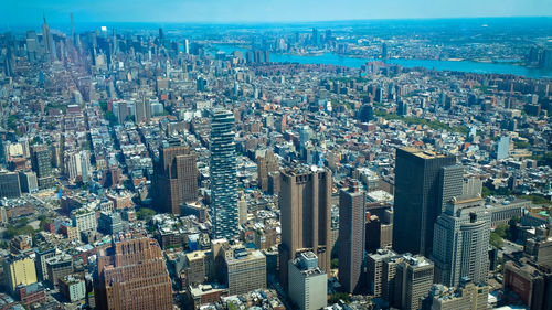 High angle view of modern buildings in city against sky