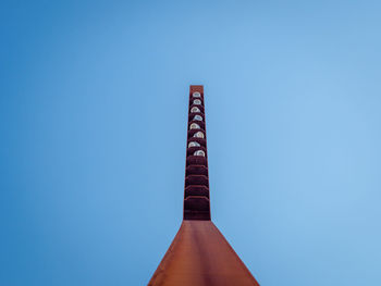 Low angle view of building against clear blue sky