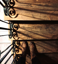 Low section of person standing on bicycle