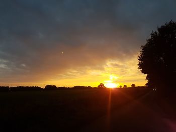 Scenic view of silhouette landscape against sky during sunset