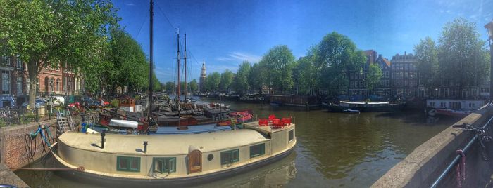 Boats moored in canal