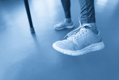 Low section of woman standing on floor