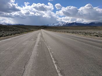 Empty road against sky