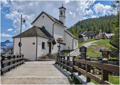 Street amidst buildings against sky