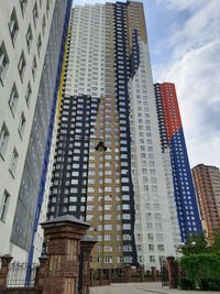 Low angle view of modern buildings against sky