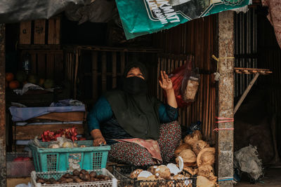 Woman standing at market stall