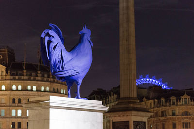 Low angle view of historical building at night