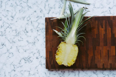 Directly above shot of pineapple on cutting board